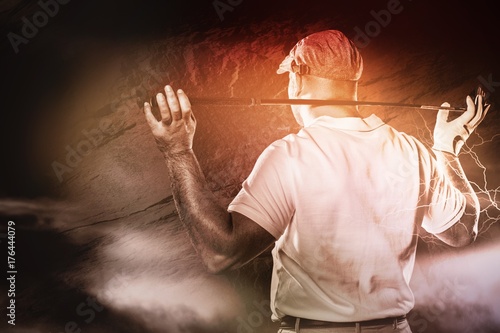composite-image-of-rear-view-of-golf-player-holding-a-golf-club