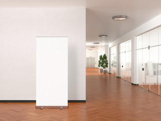 Blank roll up banner stand in modern office