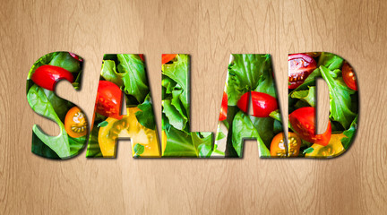 Wall Mural - Salad word covered with various vegetables on a wooden kitchen cutting board