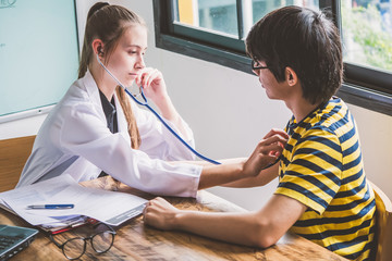 Young pretty future doctor on classes learning how to treat a patient