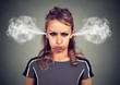 © pathdoc - Closeup portrait of angry young woman, blowing steam coming out of ears