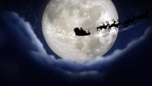 Blue Xmas Night With Moon And Clouds With Santa Claus Sleight And Reindeer Silhouette Enter And Exit Flying With Text Space To Place Logo Or Copy.Animated Christmas Present Greeting Post Card 4k Video