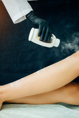 Wall Mural - Woman using powder talc for sugaring process