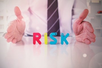 Poster - Composite image of mid section of businessman with colorful risk