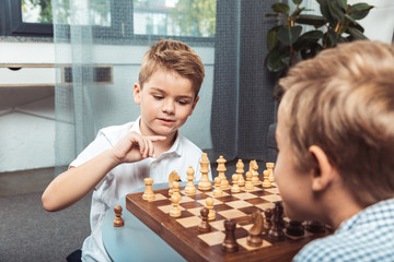 Wall Mural - little boys playing chess