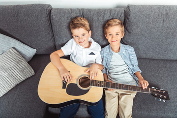 Wall Mural - little brothers with guitar