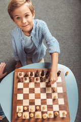 Wall Mural - boy playing chess