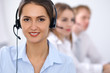 © rogerphoto - Call center. Focus on beautiful business  woman in headset
