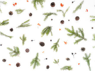 Wall Mural - Pattern of Christmas tree branches, cones on white background, top view. New Year, christmas background, frame. Flat design.