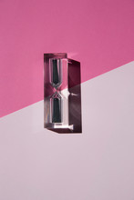 Hourglass On A Pink Background