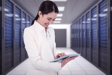 Poster - Composite image of smiling businesswoman using tablet