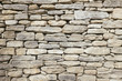 © Paul Edmondson/Stocksy - Detail of medieval stone wall, Provence, France
