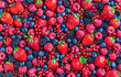 Berries overhead large closeup colorful assorted mix of strawbwerry, blueberry, raspberry, blackberry, red currant in studio on dark background in studio