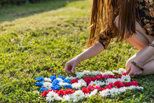 Young Woman Making An American Flag Out Of Flowers