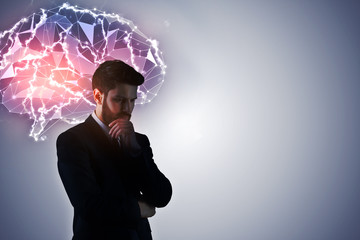 Wall Mural - thoughtful businessman with digital brain