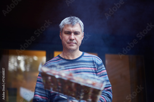 Close Up Portrait Of Handsome Caucasian Man Cooking Steak On