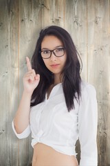 Sticker - Composite image of woman in glasses pointing up