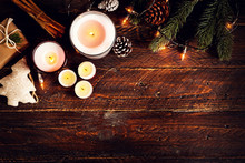 Christmas Candle And Rustic Decoration On Wood Table With Christmas Lights In Night Party. Copy Space, Flat Lay, Top View. Vintage Color Style.