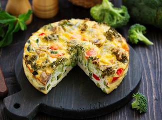 Wall Mural - Dietary vegetable pie with broccoli, zucchini, peas and pepper with cheese.