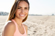 © 2mmedia - beautiful young woman smiling at the beach.