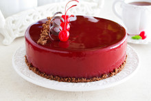 Chocolate Cherry Cake Covered With A Mirror Coating.