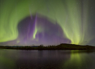 aurora borealis over the river. river paypudyna. polar urals. russia.