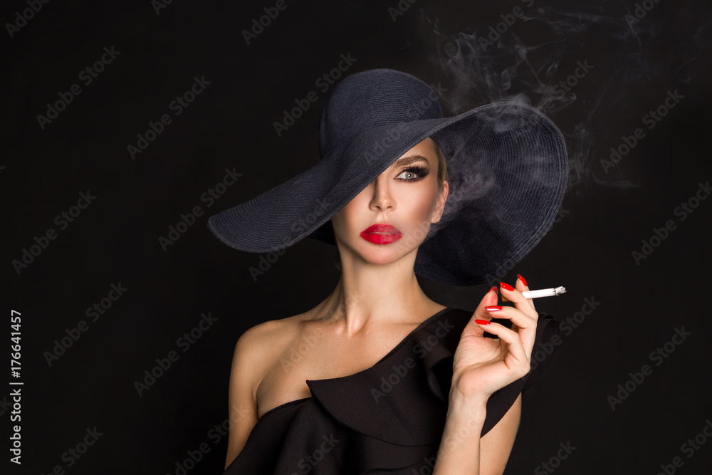 femme fatale cigarette Elegant woman, in black hat with in hand. On black background Stock Photo 15 Ways On How To