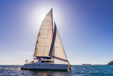 Fototapeta  - Backlit catamaran