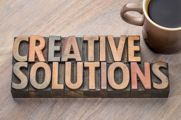 Sticker - creative solutions word abstract in wood type