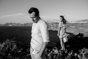 Wall Mural - Black&white photo of a young couple with a view to the sea