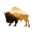 Silhouette of bison with autumn mountain panorama.