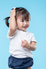 Wall Mural - Little girl hand touch her head