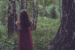© allenkayaa - Pretty girl in red dress in a summer forest in the mountains
