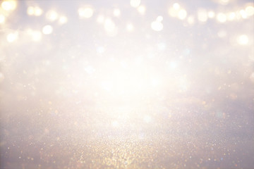 glitter vintage lights background. silver and light gold. de-focused