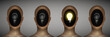bright idea concept, row of man heads with bulb inside and one in shine, be creative,