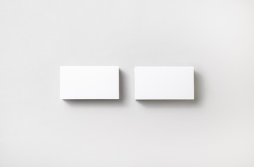 Wall Mural - Blank business cards on paper background. Template for branding identity. Studio shot.