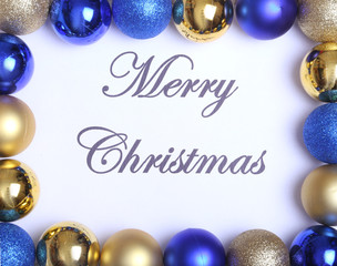 Wall Mural - Text merry christmas on paper with many balls