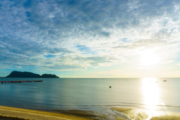 Wall Mural - beautiful dramatic beach and seascape and skyline with blue sky and fluffy cloud and mountain on the island in the sea with sunshine in the morning. holiday, travel, tourism concept