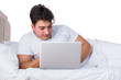 © Elnur - Man in bed suffering from insomnia