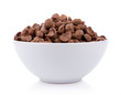 chocolate cereals in white bowl on white background. Cornflakes