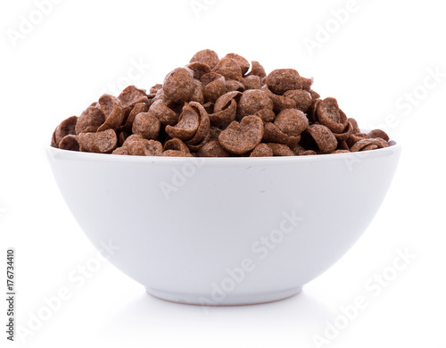 Fotomural chocolate cereals in white bowl on white background. Cornflakes