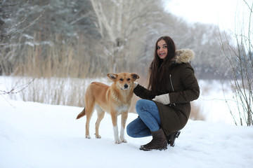 Beautiful girl in a beautiful winter park