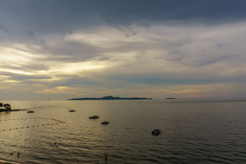 Wall Mural - beautiful panorama landscape of sea at dusk in evening when sunset with multicolor light with mountain, blue sky and cloud  background. sky and sea twilight.