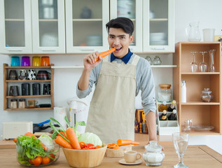 Asian young man is cooking