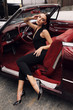 © dariyad - beautiful girl with dark hair in elegant clothes posing in luxurious car