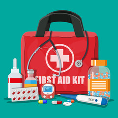 Wall Mural - Medical first aid kit with pills and devices