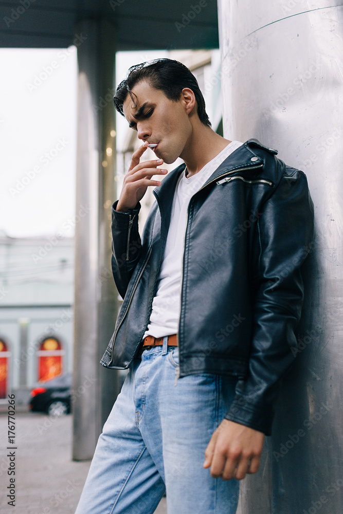 confident casual cool man smoking. addiction bad habit youth lifestyle  cancer concept Stock Photo