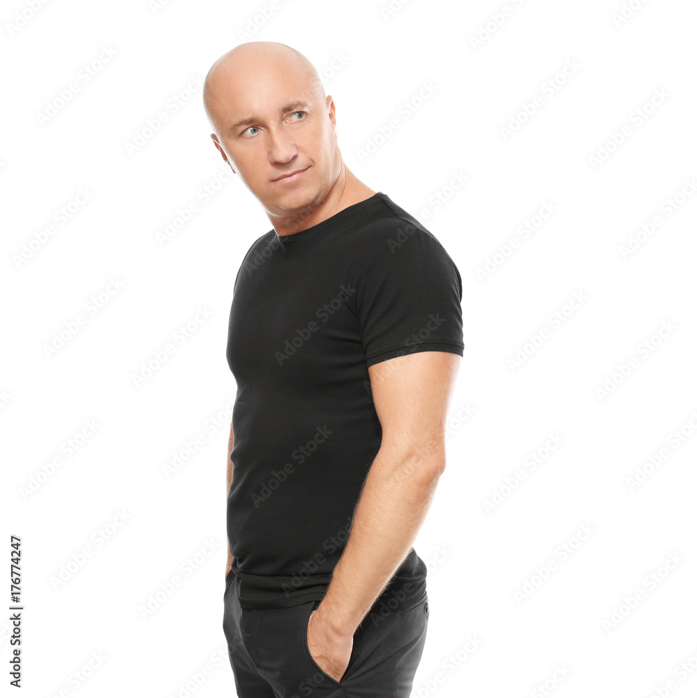 Bald man in black t-shirt on white background