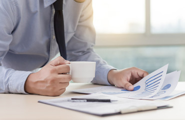 Businessman working reading documents graph financial to job succes Analyze document plans