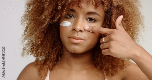 Mixed Race Black Woman With Blonde Curly Hair In Studio With A